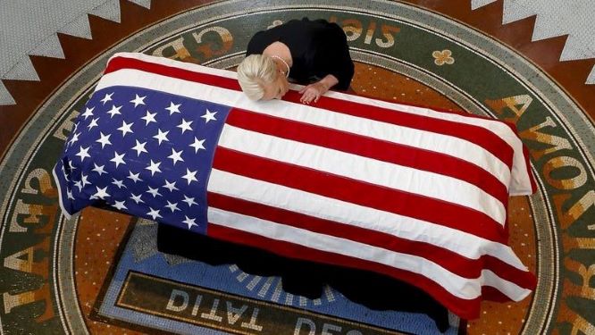american flag over casket