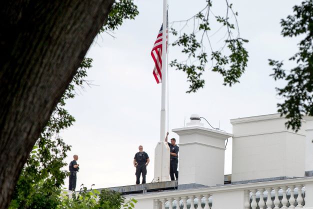flying american flag on flagpole