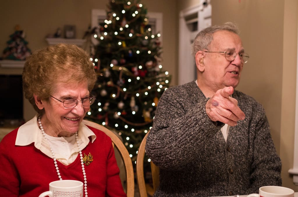an elderly couple at the dinner table