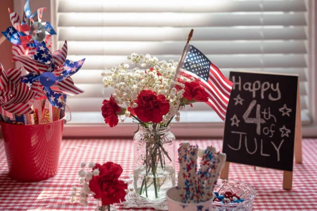 patriotic flower and american flag on a table