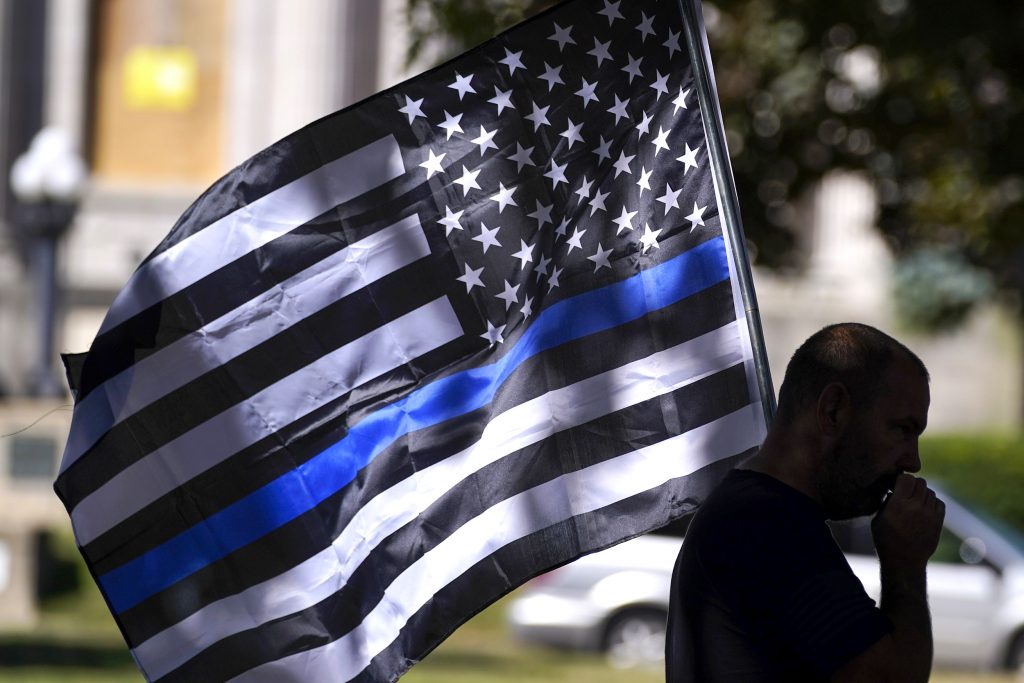 The Black And White American Flag With Blue Stripe​