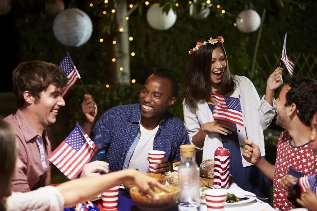 Friends Celebrating 4th Of July Holiday With Backyard Party